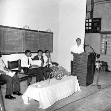 Prof. R. G. Narayanamurthi addreses a gathering during an event while students look on, 1968
