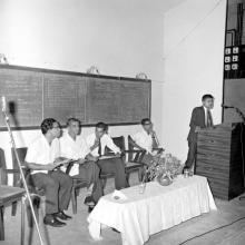 A gentleman addresses the audience during an event as Prof. R. G. Narayanamurthi and others look on, 1968