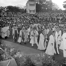 The academic procession enters the Open Air Theatre and makes its way to the dais