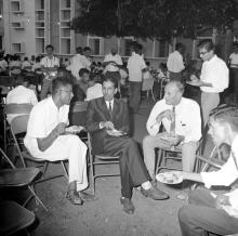 Prof. A. Ramachandran and Prof. R. J. H. Bisanz having refreshments during an event in 1968