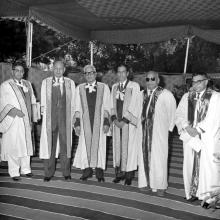 The dignitaries pose for a photo in the academic robes