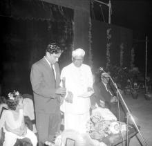 Dr. A. L. Mudaliar presents a memento to Mr. R. Natarajan at the farewell ceremony