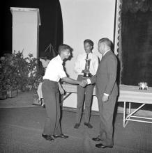 Mr. H. V. R. Iengar presents a trophy to a student during the Tenth Institute Day, 1969