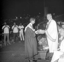 A student receives an award from Mr. H. V. R. Iengar (Chairman, Board of Governors)