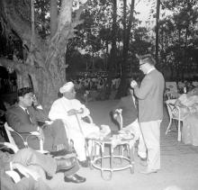 Distinguished guests in conversation over refreshments at the farewell ceremony thrown for Mr. R. Natarajan