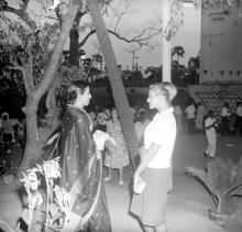 Mrs. Parvatham Natarajan converses with Mrs. Rouve during the farewell party that was thrown for Mr. R. Natarajan 