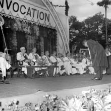 A graduate bows to the dignitaries after receiving his degree