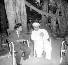 Mr. R. Natarajan and Dr. A. L. Mudaliar in a conversation at the farewell ceremony thrown for Mr. R. Natarajan