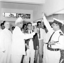 Vanavani School being declared open with the striking of the school gong by Dr. A. L. Mudaliar, 1963