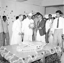 Viewing a three-dimensional model of Vanavani School, 1963