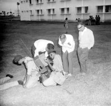 NCC cadets operate a field telephone at the NCC camp, 1965