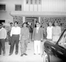 A photograph taken outside Narmada Hostel with the Director, Registrar, Warden and others at the NCC camp, 1965