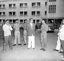 Prof. B. Sengupto and a senior officer in conversation outside Narmada Hostel at the NCC Camp, 1965