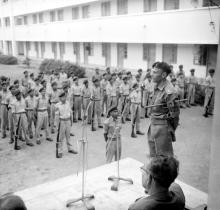 Cadets being addressed by a senior officer at the NCC camp, 1965