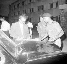 Prof. B. Sengupto signing the Visitors Book at the NCC Camp, 1965