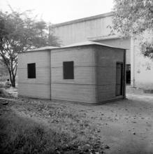 A structure which appears to be a cabin that was made at the FRP Centre