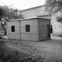 A structure which appears to be a cabin that was made at the FRP Centre