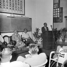 A gentleman addresses the audience during the symposium on Introduction of SI system