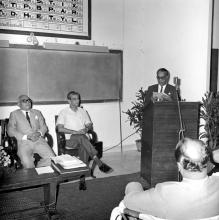 A gentleman addresses the audience during the symposium on Introduction of SI system