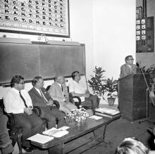 A gentleman addresses the audience during the symposium on Introduction of SI system