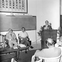 A gentleman addresses the audience during the symposium on Introduction of SI system