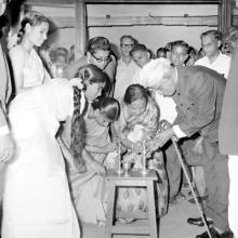 Dr. A. L. Mudaliar lights the lamp, marking the inauguration of the Central Library building