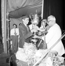 Dr. P. Subbarayan presents a trophy to Mr. Sivaram