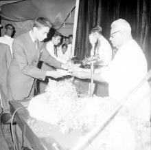 Dr. P. Subbarayan gives a prize to Mr. Sudhir Puri (possibly)