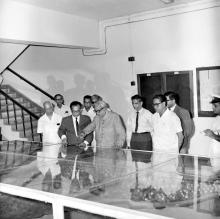 Prof. B. Sengupto (Director) uses a 3D model of the campus to explain the development of IIT Madras to Mr. M. C. Chagla (Union Minister for Education, New Delhi) during his visit to the Institute