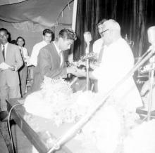 Dr. P. Subbarayan (Union Minister of Transport and Communications) hands over a prize to Mr. Jacob Dominic