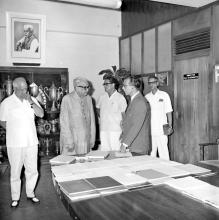 Mr. M. C. Chagla (Union Minister for Education) discusses research reports with Prof. B. Sengupto (Director)