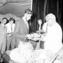 Dr. P. Subbarayan (Union Minister of Transport and Communications) hands over a prize to Mr. Syed Abdul Aleem
