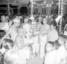 Devotees standing around the idol, 1965