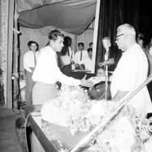 Dr. P. Subbarayan shakes hands with a student