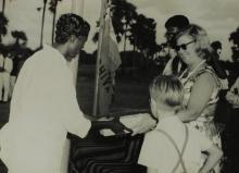 Mrs. Ann Lohmann Fischer gives away a prize to a student at the first Inter-Collegiate Sports Meet, 1964
