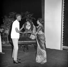 A student receiving a trophy at the annual Literary and Cultural Week