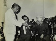 Dr. A. L. Mudaliar receives the 'Journal of Mathematical and Physical Sciences' from Mr. V. R. Nedunchezhian