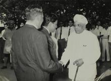 Dr. A. L. Mudaliar  is received by Mr. R. Natarajan and Mr. Y. S. Ramaswamy