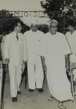 Dr. P. Subbarayan is escorted by Dr. A. L. Mudaliar and Prof. B. Sengupto 