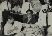 A sentimental moment: Dr. P. Subbarayan (Union Minister of Transport and Communications) gives a prize to a child