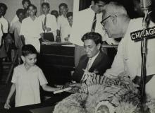 A sentimental moment: Dr. P. Subbarayan gives a prize to a child