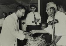 Dr. P. Subbarayan  hands over a prize to Prof. E. G. Ramachandran