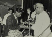 Dr. P. Subbarayan hands over a prize to Mr. Jacob Dominic