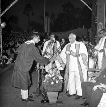 A student receives his award from the chief guest, Dr. V. V. Giri 