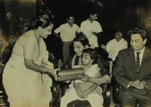 Mrs. Shanti Sengupto presents a gift to Mrs. Parvatham Natarajan at the farewell ceremony organised for Mr. R. Natarajan 