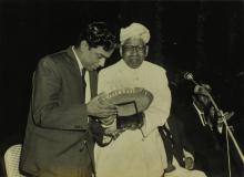 Dr. A. L. Mudaliar presents a memento to Mr. R. Natarajan at the farewell ceremony organised for him