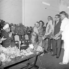 Mrs. Radha Bai receives a memento at the farewell function of Dr. A. L. Mudaliar