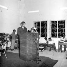 A student representative addresses the audience at Dr. A. L. Mudaliar’s farewell function