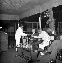 Dr. K. L. Rao receives a brochure from Prof. P. C. Varghese, 1970