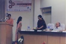Mrs. Jayashree Ananth receives a bouquet of flowers from a student at Saarang, 2005